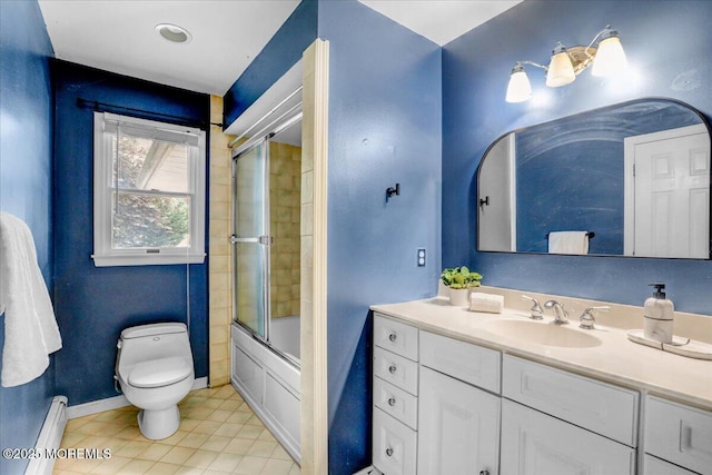 635 Susan Ln, Brielle, NJ 08730 - bathroom featuring a baseboard heating unit, vanity, toilet, bath / shower combo with glass door, and tile patterned floors