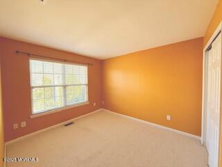 284 Brookfield Dr, Jackson, NJ 08527 - empty room with light carpet