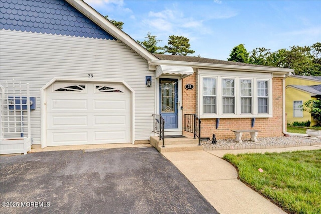 2B Greenwood Ln Unit 62, Whiting, NJ 08759 - view of front of house featuring brick siding, driveway, and an attached garage