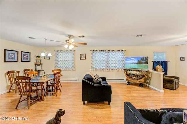 2B Greenwood Ln Unit 62, Whiting, NJ 08759 - living room featuring light wood-style flooring, ceiling fan, a baseboard radiator, and a chandelier