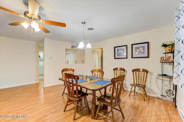 2B Greenwood Ln Unit 62, Whiting, NJ 08759 - dining area with light wood-type flooring, ceiling fan, baseboards, and a chandelier