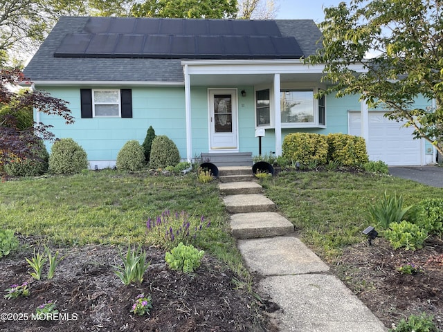 11 Bryant Dr, Jackson, NJ 08527 - view of front of property with roof with shingles, roof mounted solar panels, and a garage