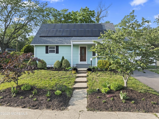 11 Bryant Dr, Jackson, NJ 08527 - view of front of property featuring roof with shingles and roof mounted solar panels