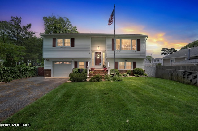 1312 Dorset Dock Rd, Point Pleasant, NJ 08742 - bi-level home with asphalt driveway, an attached garage, and brick siding