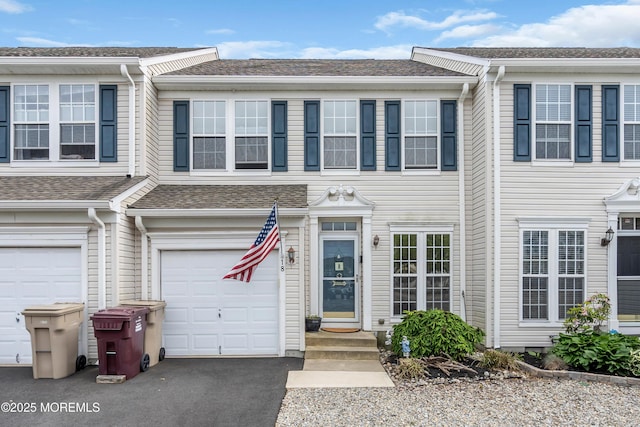 18 Skimmer Ln Unit 53, Bayville, NJ 08721 - view of property with a garage, driveway, and roof with shingles