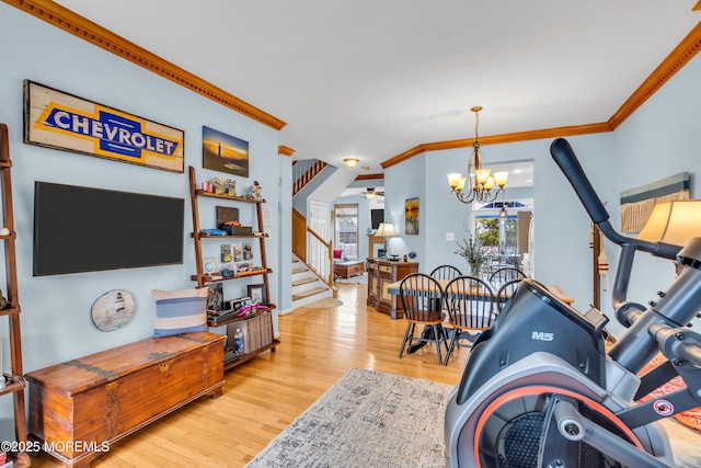 18 Skimmer Ln Unit 53, Bayville, NJ 08721 - dining area with crown molding, wood finished floors, stairs, and a chandelier
