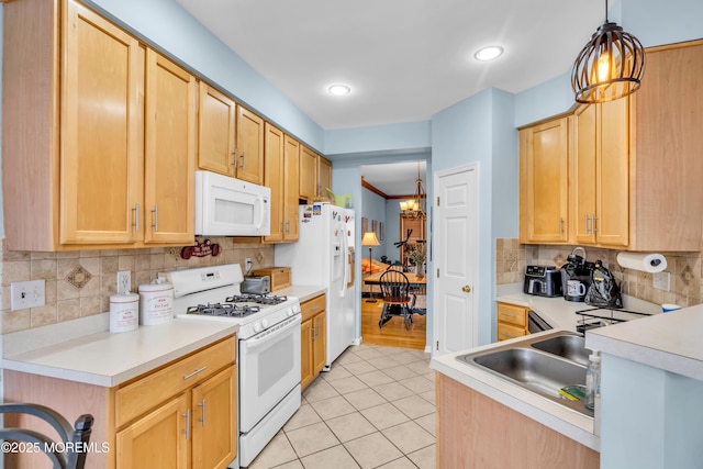 18 Skimmer Ln Unit 53, Bayville, NJ 08721 - kitchen with white appliances, light tile patterned flooring, backsplash, light brown cabinetry, and light countertops