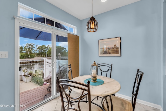 18 Skimmer Ln Unit 53, Bayville, NJ 08721 - dining area featuring light tile patterned flooring, a water view, and baseboards