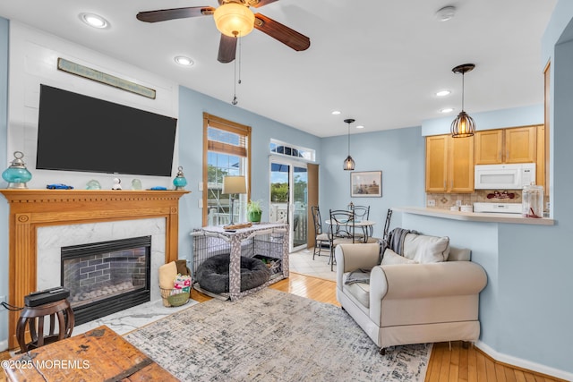 18 Skimmer Ln Unit 53, Bayville, NJ 08721 - living room with ceiling fan, light wood-style floors, a fireplace, recessed lighting, and baseboards