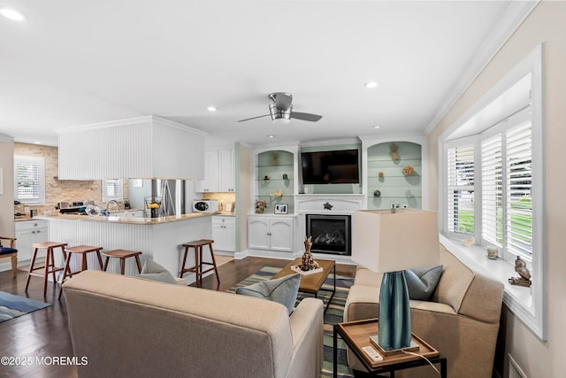 3206 Chicopee Pl, Point Pleasant, NJ 08742 - living area featuring dark wood-type flooring, healthy amount of natural light, a ceiling fan, a glass covered fireplace, and recessed lighting