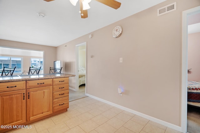 13 Lake Superior Dr, Little Egg Harbor, NJ 08087 - kitchen with a ceiling fan, baseboards, and light tile patterned floors