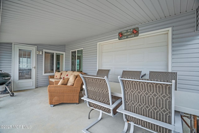 13 Lake Superior Dr, Little Egg Harbor, NJ 08087 - view of patio with an outdoor living space and an attached garage