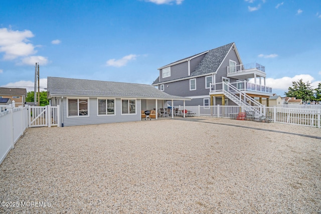 13 Lake Superior Dr, Little Egg Harbor, NJ 08087 - rear view of property featuring a fenced backyard, a shingled roof, and a gate
