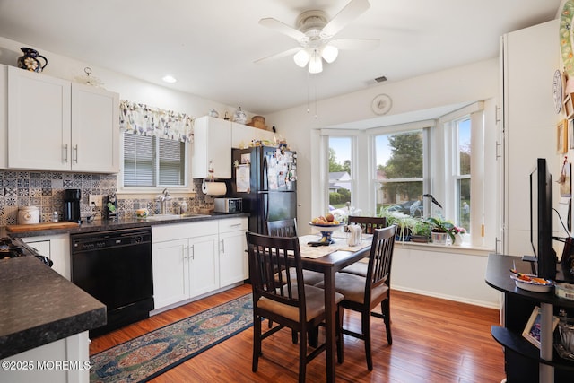 218 Mohican Ln, Little Egg Harbor, NJ 08087 - kitchen featuring black appliances, a sink, dark countertops, backsplash, and ceiling fan