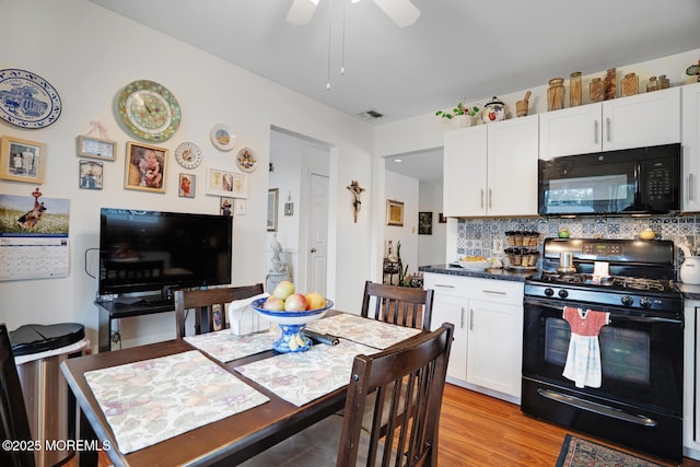 218 Mohican Ln, Little Egg Harbor, NJ 08087 - kitchen featuring black appliances, white cabinets, backsplash, a ceiling fan, and light wood-style flooring