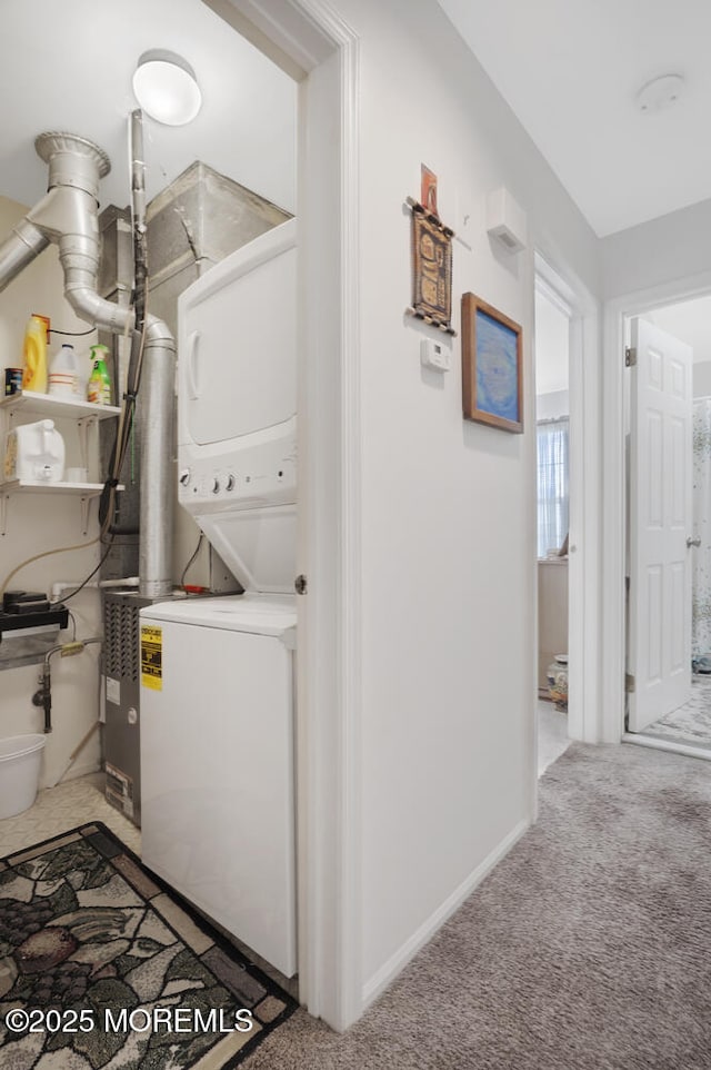 218 Mohican Ln, Little Egg Harbor, NJ 08087 - washroom featuring stacked washing machine and dryer, carpet flooring, and baseboards