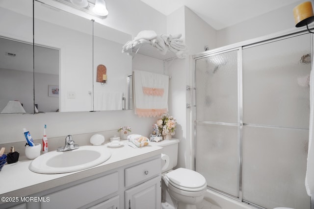 218 Mohican Ln, Little Egg Harbor, NJ 08087 - bathroom featuring toilet, a stall shower, and vanity