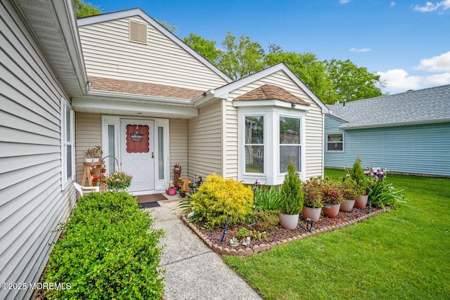 218 Mohican Ln, Little Egg Harbor, NJ 08087 - view of exterior entry with a yard and roof with shingles