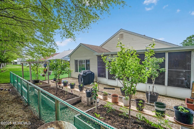 218 Mohican Ln, Little Egg Harbor, NJ 08087 - rear view of property with a vegetable garden and a sunroom