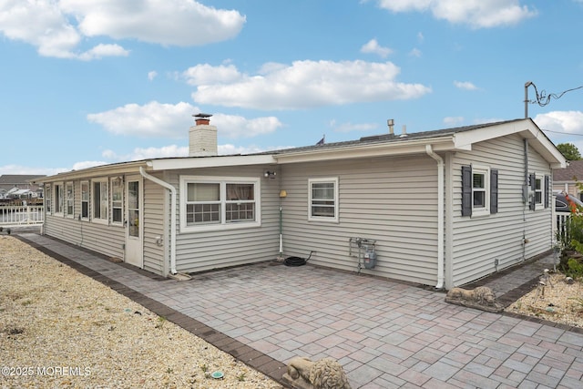 927 Beach Haven W Blvd, Manahawkin, NJ 08050 - back of house featuring a chimney and a patio area