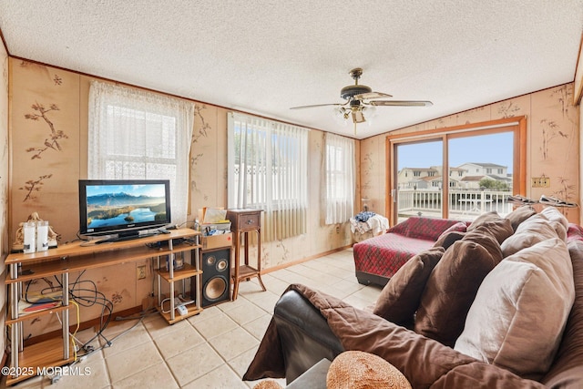 927 Beach Haven W Blvd, Manahawkin, NJ 08050 - living room featuring a ceiling fan, a textured ceiling, light tile patterned flooring, vaulted ceiling, and wallpapered walls