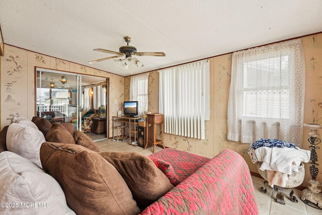 927 Beach Haven W Blvd, Manahawkin, NJ 08050 - tiled living room featuring wallpapered walls, ceiling fan, and a textured ceiling