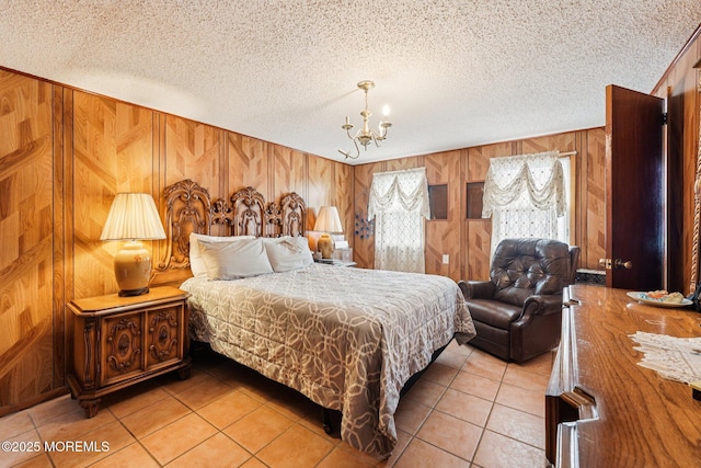 927 Beach Haven W Blvd, Manahawkin, NJ 08050 - bedroom with a chandelier, light tile patterned floors, wood walls, and a textured ceiling