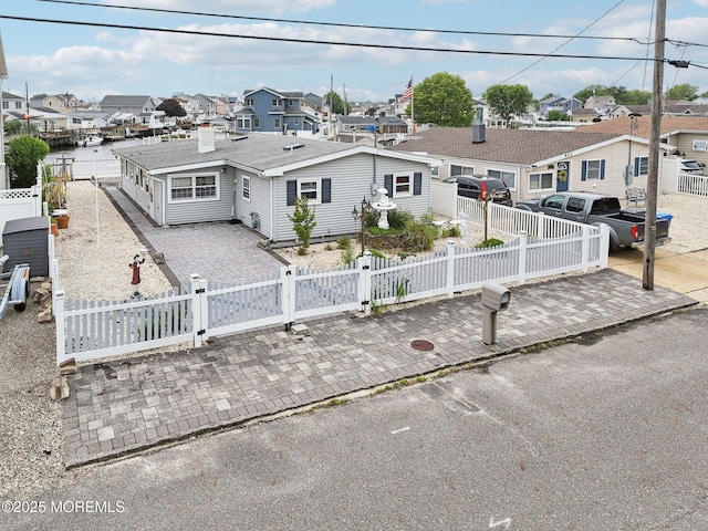 927 Beach Haven W Blvd, Manahawkin, NJ 08050 - view of front of property with a residential view, a fenced front yard, and a gate
