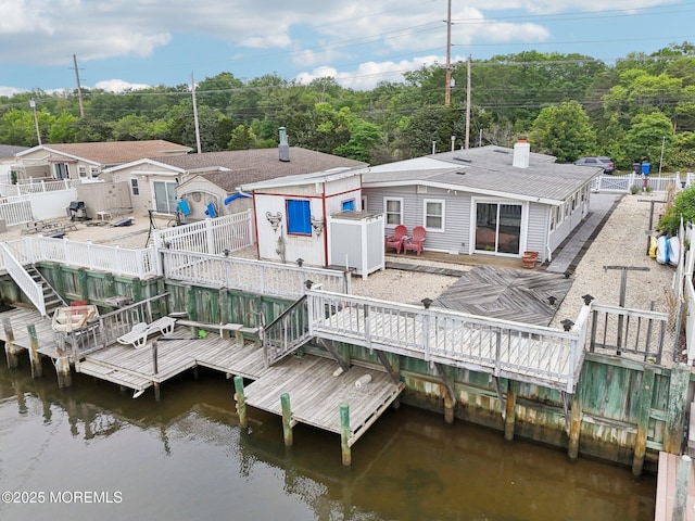 927 Beach Haven W Blvd, Manahawkin, NJ 08050 - dock with a wooden deck, a fenced backyard, and stairs