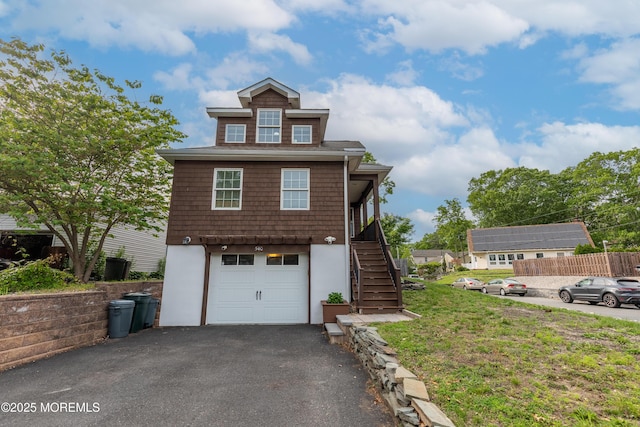 540 Vaughn Ave, Forked River, NJ 08731 - view of front of home with stairs, asphalt driveway, an attached garage, stucco siding, and a front yard