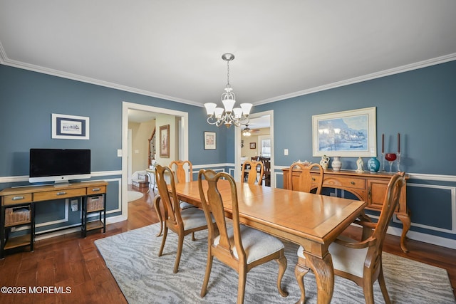 41 Revere Pl, Freehold, NJ 07728 - dining room with a chandelier, ornamental molding, and dark wood-style floors