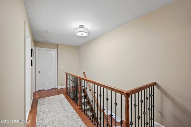 41 Revere Pl, Freehold, NJ 07728 - hall with wood finished floors, baseboards, and an upstairs landing