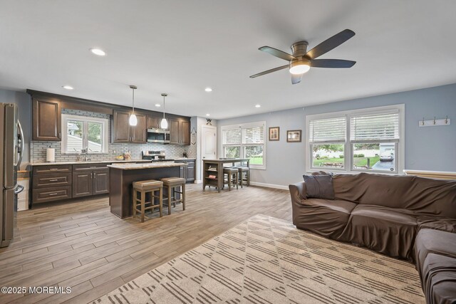 41 Revere Pl, Freehold, NJ 07728 - living area with a ceiling fan, light wood-style flooring, baseboards, and recessed lighting