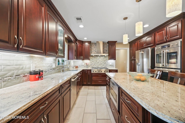 41 Revere Pl, Freehold, NJ 07728 - kitchen featuring wall chimney exhaust hood, stainless steel appliances, a sink, backsplash, and light stone counters