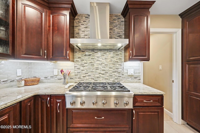 41 Revere Pl, Freehold, NJ 07728 - kitchen featuring wall chimney exhaust hood, reddish brown cabinets, stainless steel gas cooktop, and decorative backsplash