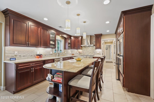 41 Revere Pl, Freehold, NJ 07728 - kitchen featuring wall chimney exhaust hood, backsplash, light tile patterned flooring, a center island, and decorative light fixtures