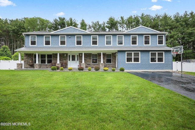 41 Revere Pl, Freehold, NJ 07728 - view of front of property with covered porch, asphalt driveway, and stone siding