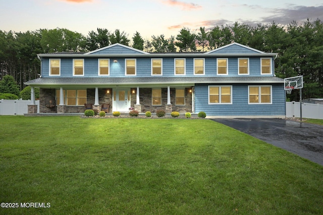 41 Revere Pl, Freehold, NJ 07728 - view of front facade featuring covered porch, driveway, and stone siding