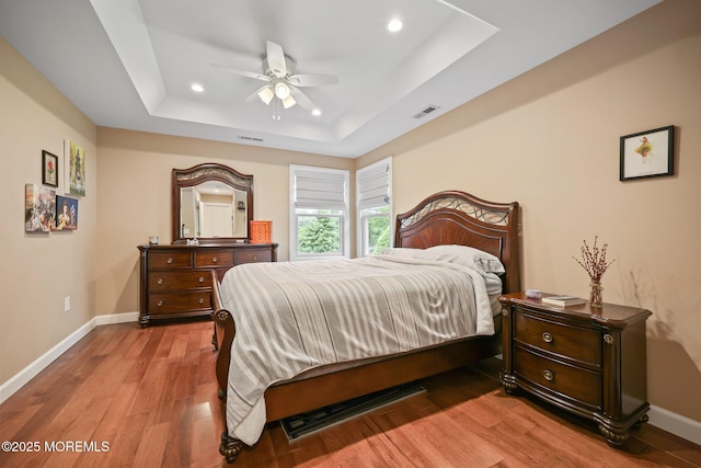 41 Revere Pl, Freehold, NJ 07728 - bedroom with a tray ceiling, recessed lighting, wood finished floors, baseboards, and ceiling fan