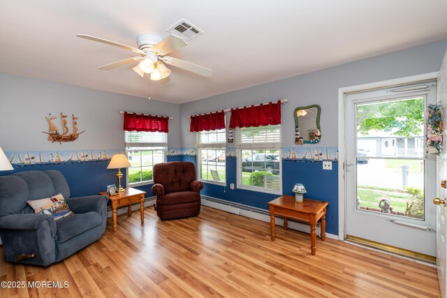 6 Manitoba Ct, Toms River, NJ 08757 - living area with light wood-type flooring, baseboard heating, and ceiling fan