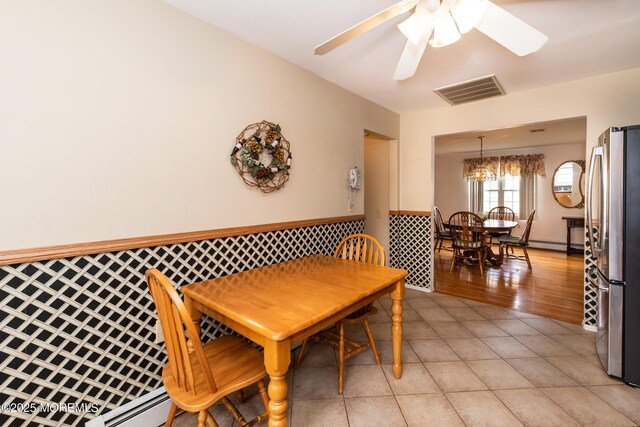 6 Manitoba Ct, Toms River, NJ 08757 - dining room with a ceiling fan, wainscoting, light tile patterned floors, and a baseboard heating unit