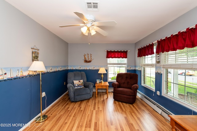 6 Manitoba Ct, Toms River, NJ 08757 - living area featuring a baseboard radiator, wood finished floors, and ceiling fan