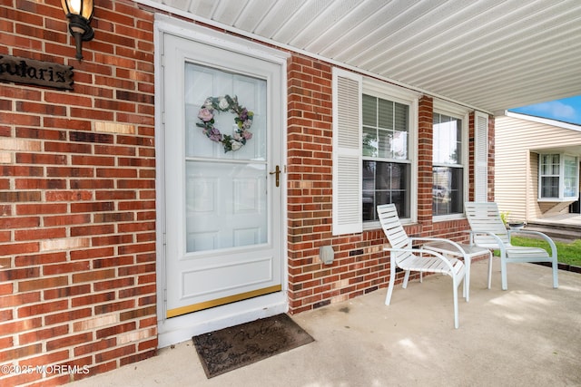 6 Manitoba Ct, Toms River, NJ 08757 - property entrance featuring covered porch and brick siding