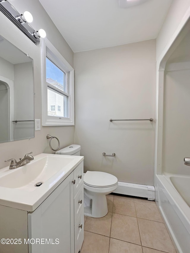 405 Old Bridge Rd, Brielle, NJ 08730 - full bathroom with a baseboard heating unit, tile patterned floors, vanity, a tub to relax in, and toilet