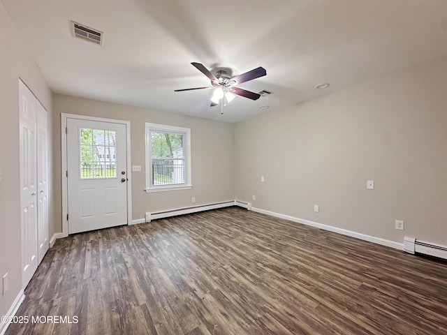 405 Old Bridge Rd, Brielle, NJ 08730 - foyer with baseboard heating, dark wood-type flooring, ceiling fan, and baseboards