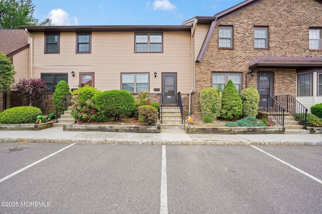 160 Village Green Way, Hazlet, NJ 07730 - view of property with uncovered parking and brick siding