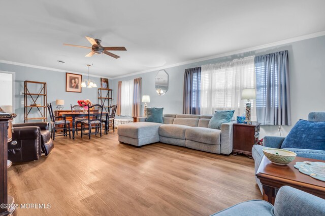 81 Encinitas Dr, Toms River, NJ 08757 - living room with ornamental molding, ceiling fan, light wood-style floors, and a chandelier