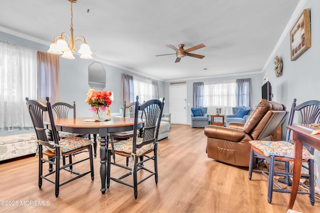 81 Encinitas Dr, Toms River, NJ 08757 - dining room with crown molding, light wood finished floors, a ceiling fan, and a chandelier