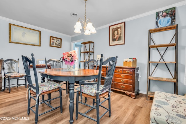 81 Encinitas Dr, Toms River, NJ 08757 - dining room with ornamental molding, light wood-style floors, a chandelier, and baseboards