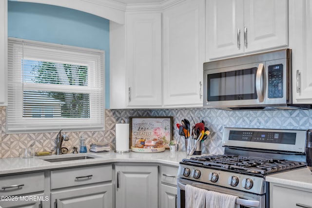 81 Encinitas Dr, Toms River, NJ 08757 - kitchen featuring stainless steel appliances, a sink, white cabinetry, and backsplash